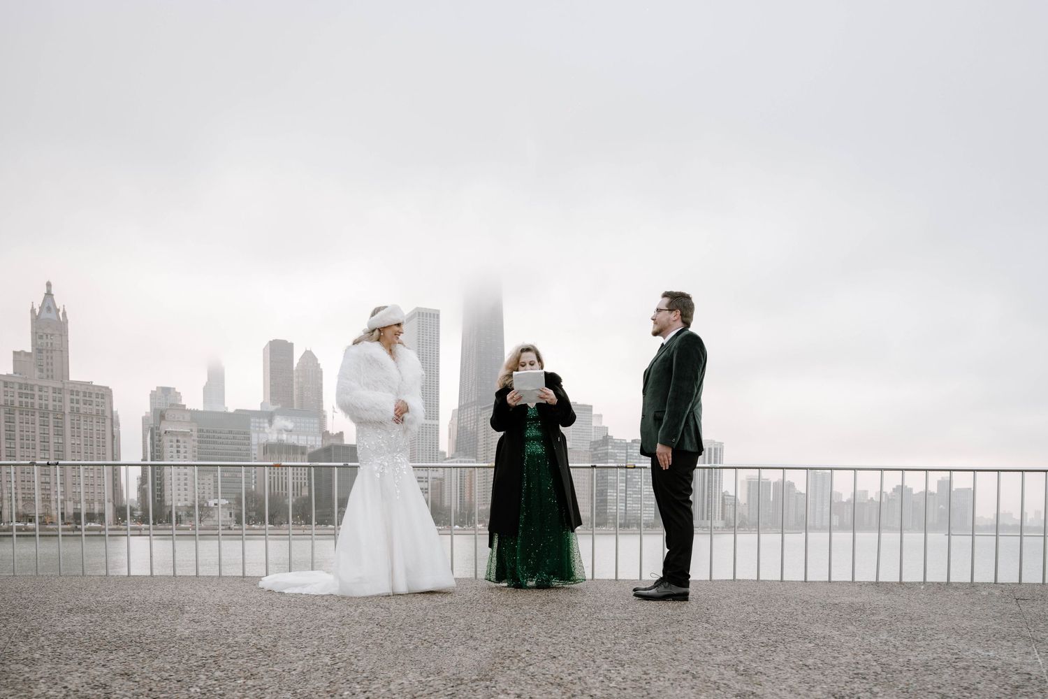 A wedding party appears on the New York City skyline as a series of silhouettes overlooking the cityscape.