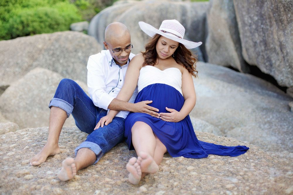 Mom and dad-to-be embracing baby bump in Melbourne maternity shoot