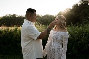 A tender moment captured between a couple during their outdoor photoshoot at golden hour.