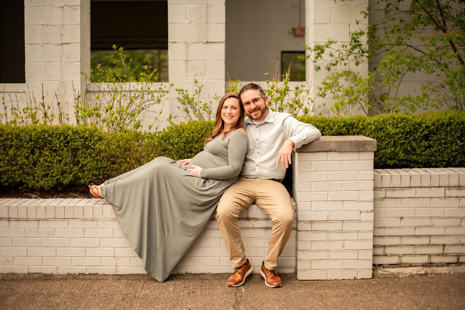 A romantic photo collage shows a couple relaxing on white brick ledges in a garden setting.