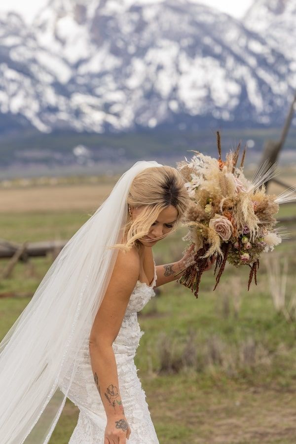 romantic wedding couple with mountains in a background