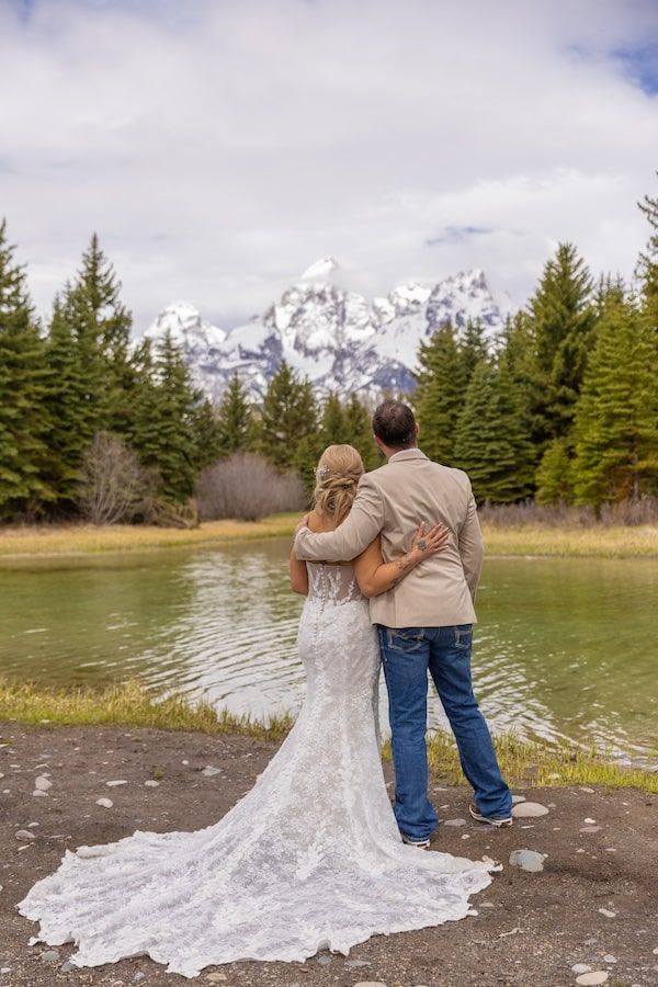 romantic wedding couple with mountains in a background