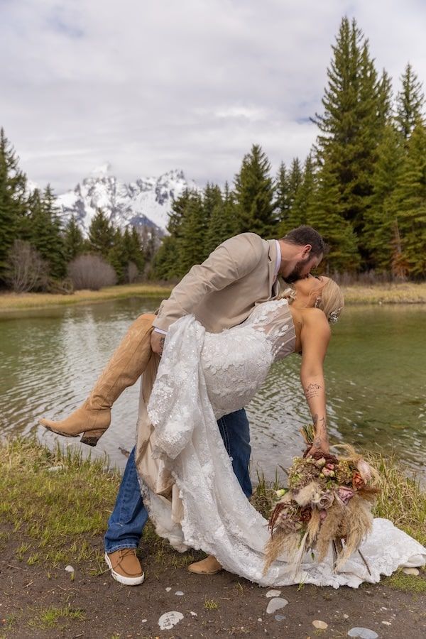 romantic wedding couple with mountains in a background
