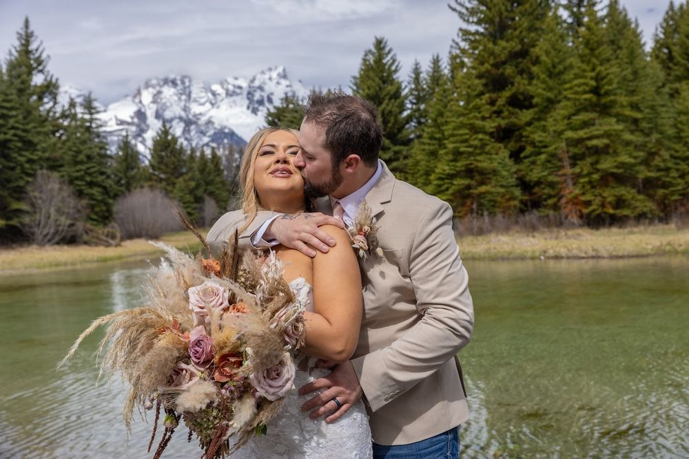 romantic wedding couple with mountains in a background