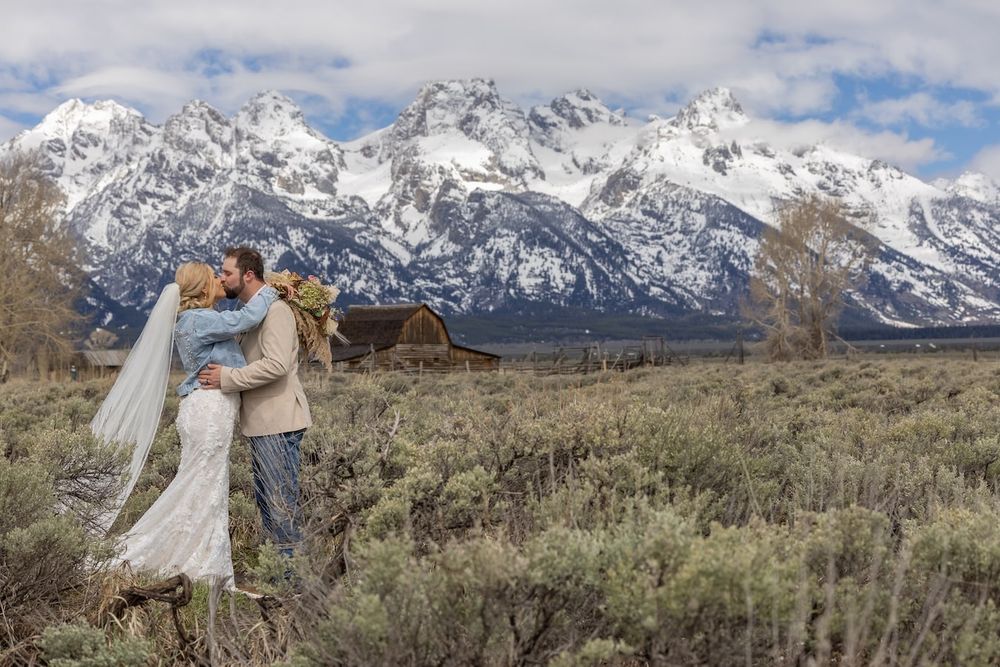 romantic wedding couple with mountains in a background