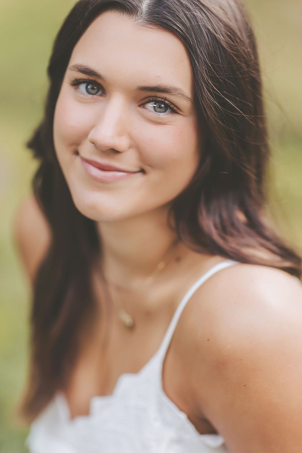 Series of candid expressions captured in warm natural lighting against a soft blurred background.