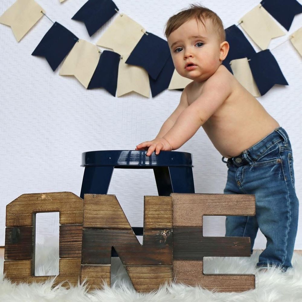 Brooks is 1 and oh so cool!  Blue & Navy with a side of rock and roll, this sweet guy was born to shine! Look at that face!  Happy Birthday!