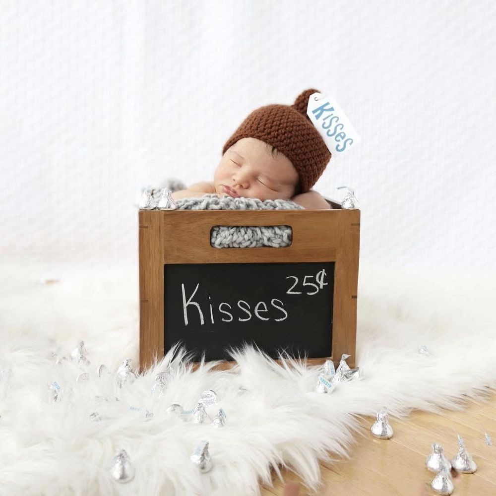 Okay...kisses 25 cents? Could this little one be any sweeter? Newborn photos for a magazine! This guy is busy now a days but still so sweet!