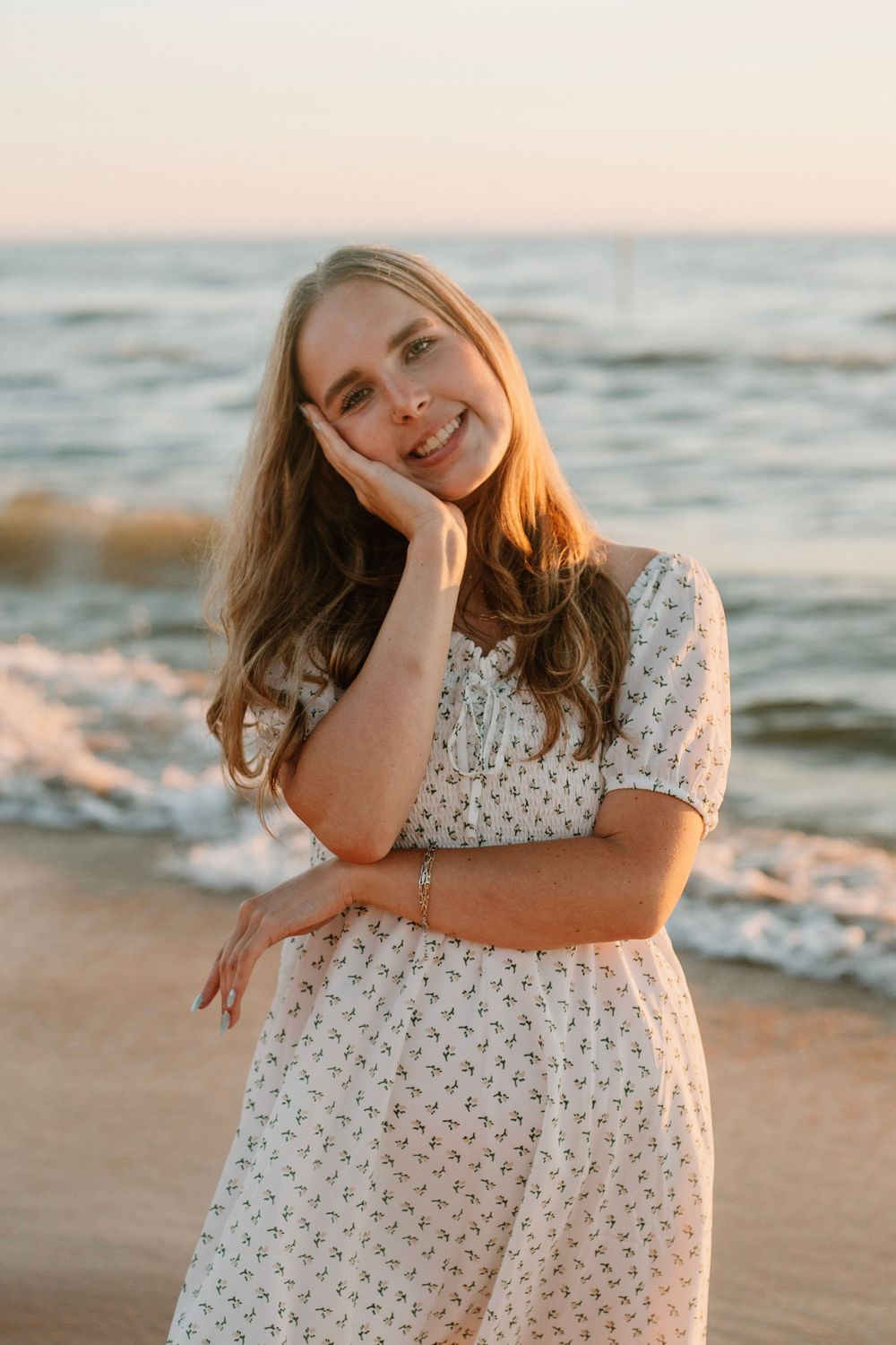 Senior girl at a beach sunset photo session in Holland, MI in front of Lake Michigan.