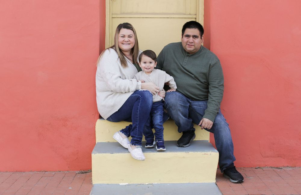 Family portrait with orange and yellow background in Urban Tucson