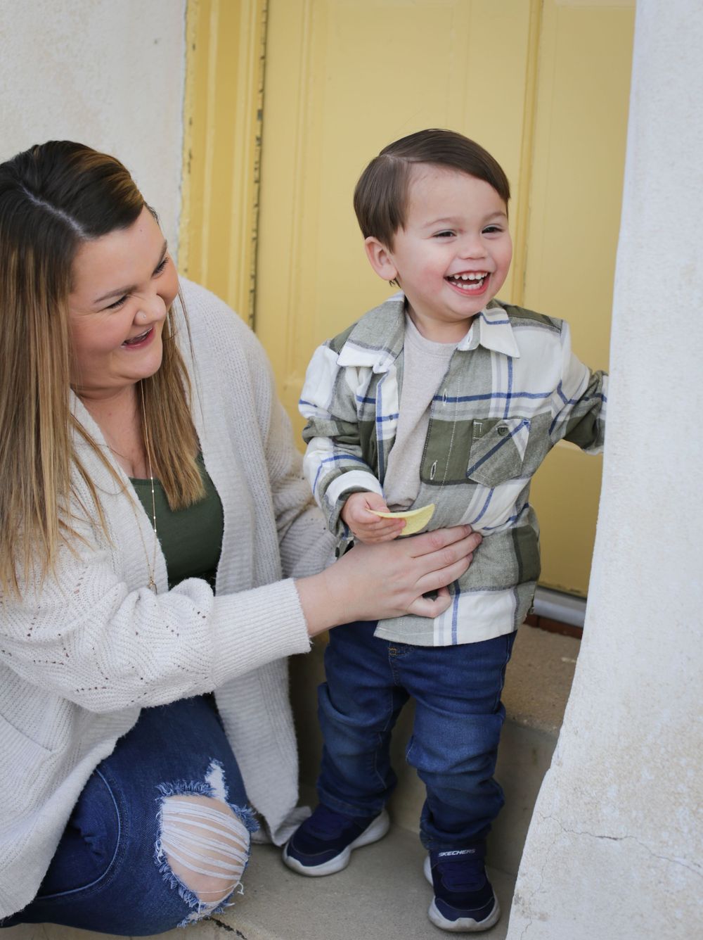 Mother smiling at toddler by Tucson family photographer Wintertime photography