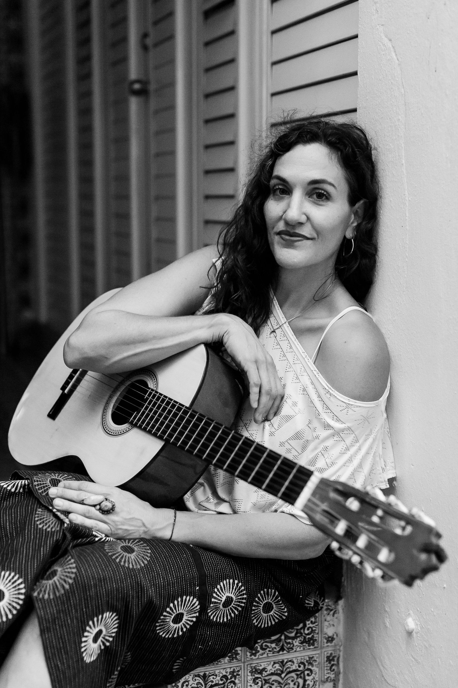 Portrait of a woman with a guitar in San Juan, Puerto Rico.