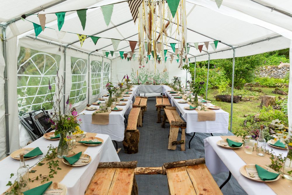 A marquee set up for a rustic wedding reception.