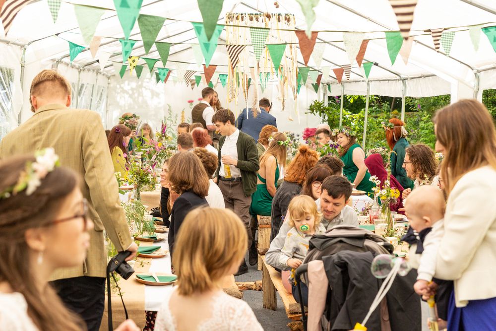 A rustic wedding reception in a marquee.