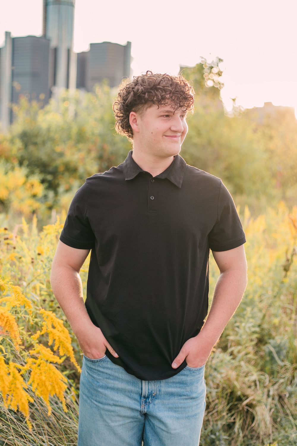 senior photography in field of flowers