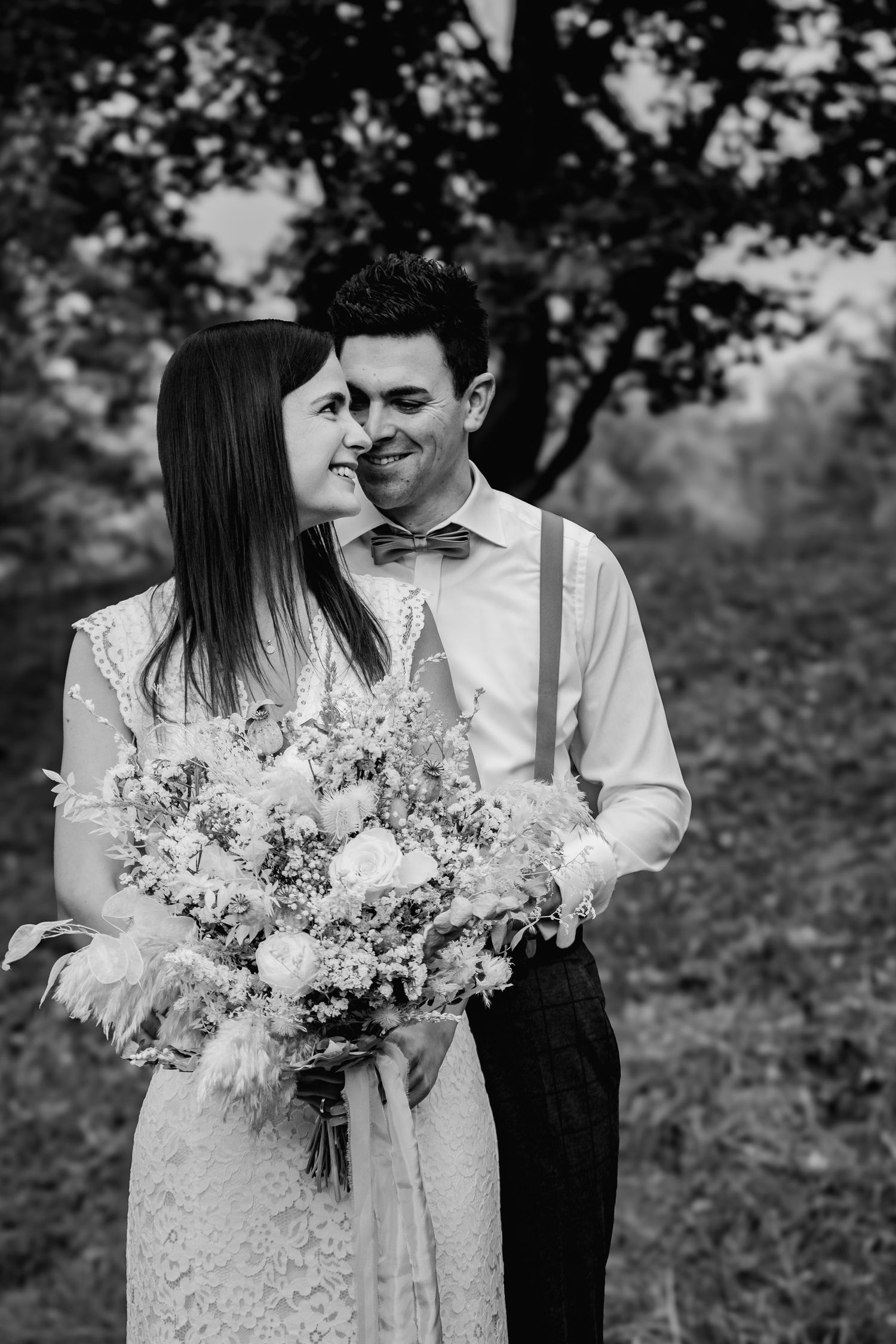 A tender black and white intimate moment captured as a couple share a close quiet moment together.