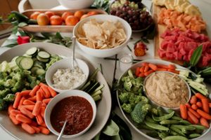 Fresh vegetable and dip platter with various spreads and crudités arranged for entertaining.