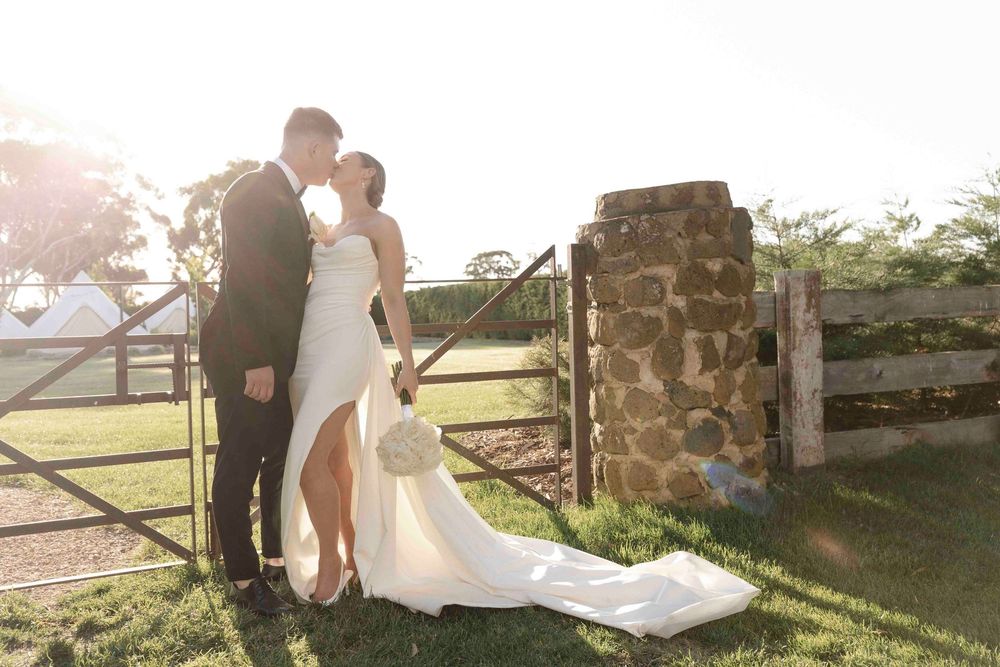 Wedding couple embracing at sunset at Warrawong Estate