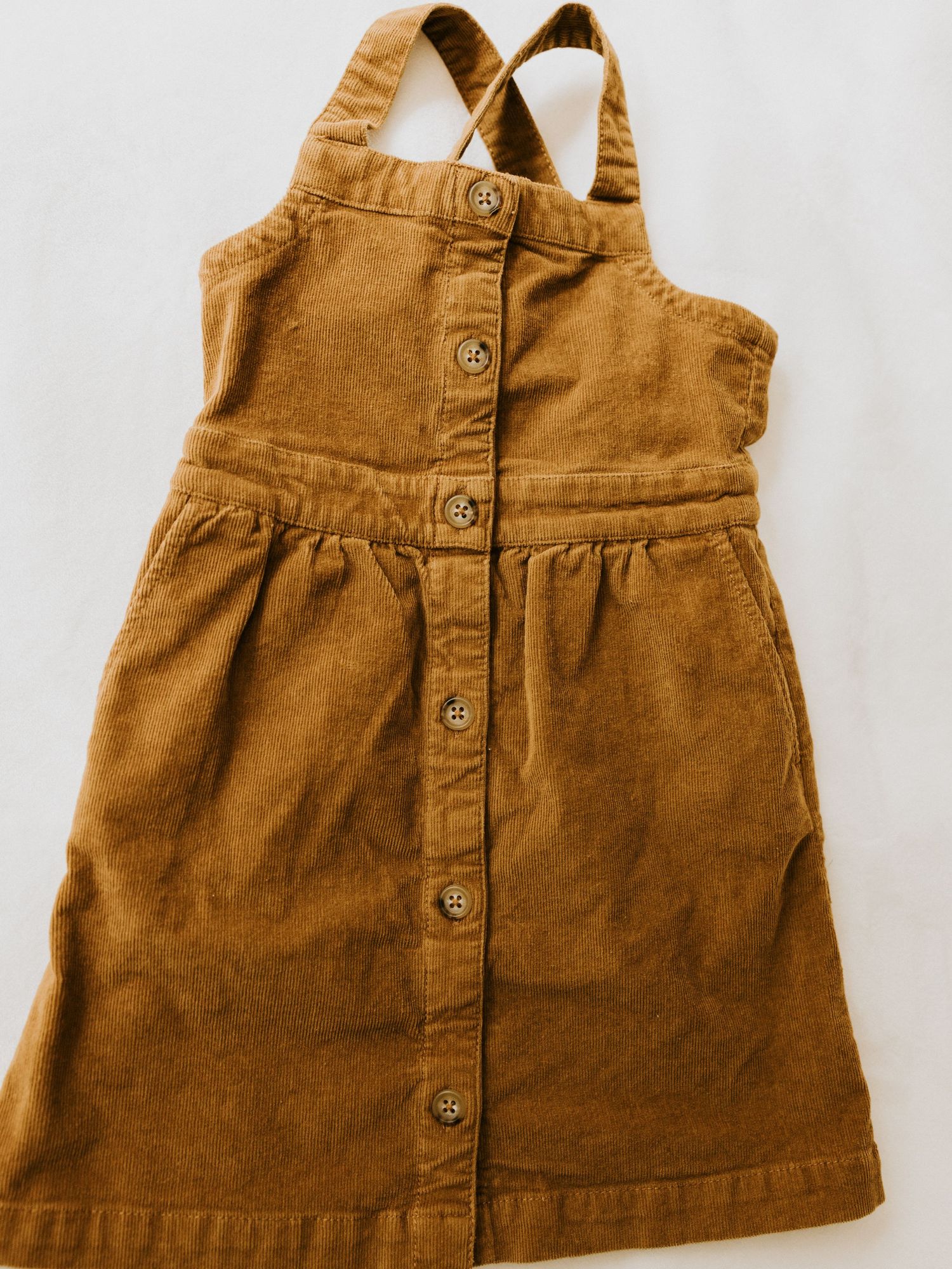 Adorable vintage-inspired baby boy outfit with white button-down shirt, blue striped suspender shorts and matching bowtie.