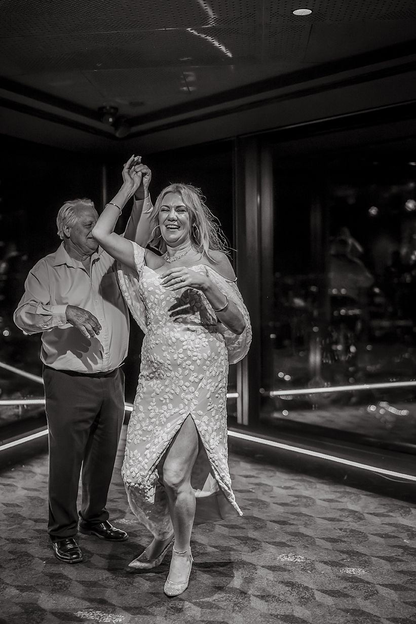 Black and white photo sequence showing couple dancing energetically on the dance floor at a wedding reception.
