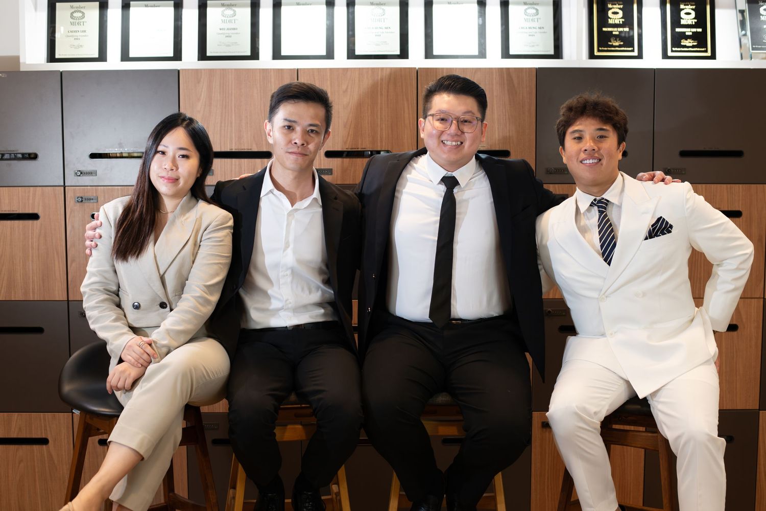 A figure in a navy blazer and khaki trousers stands in different thoughtful poses in a multiple-view image sequence.