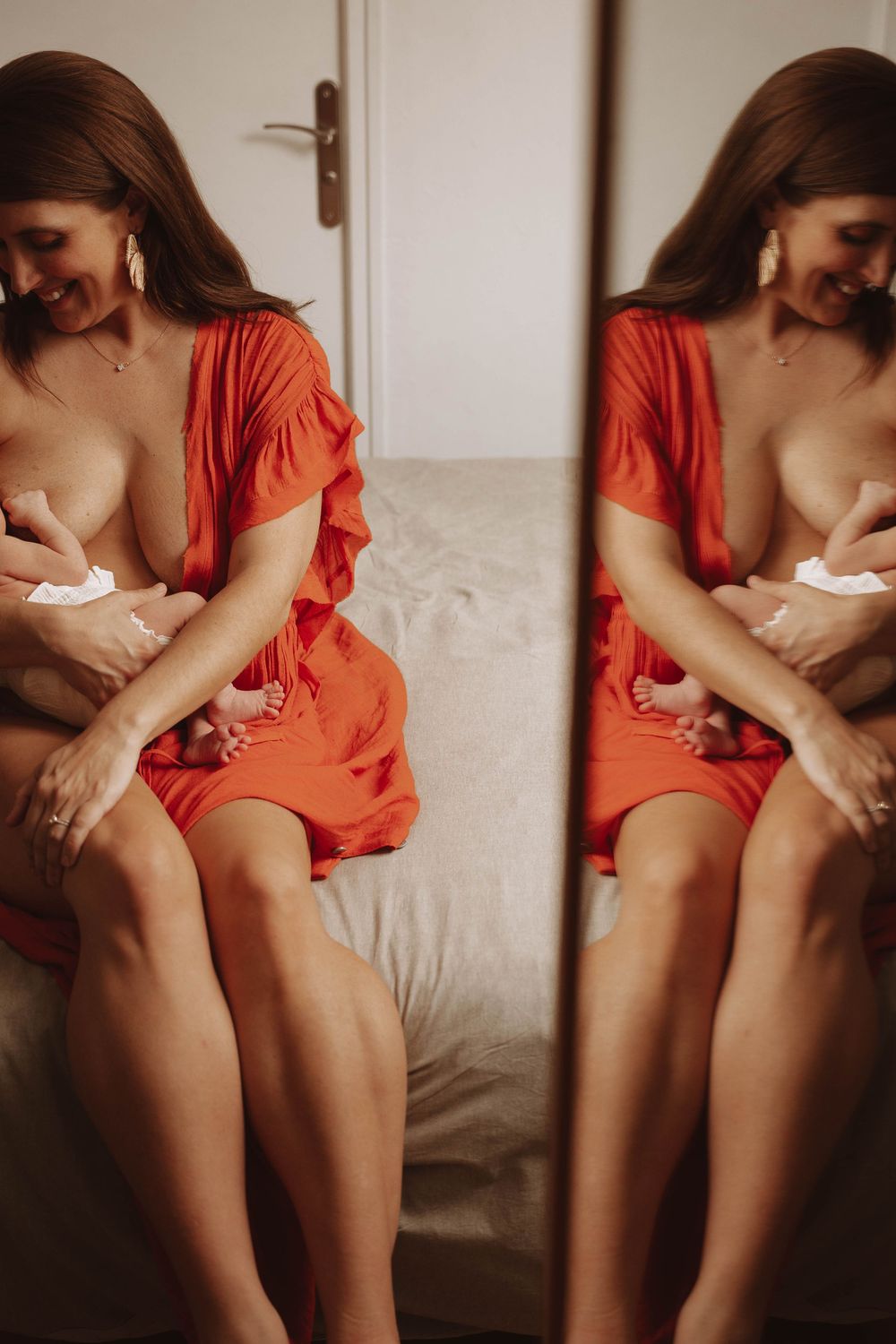 A mirrored image shows a person in a coral-colored dress seated on a couch in soft, warm lighting.