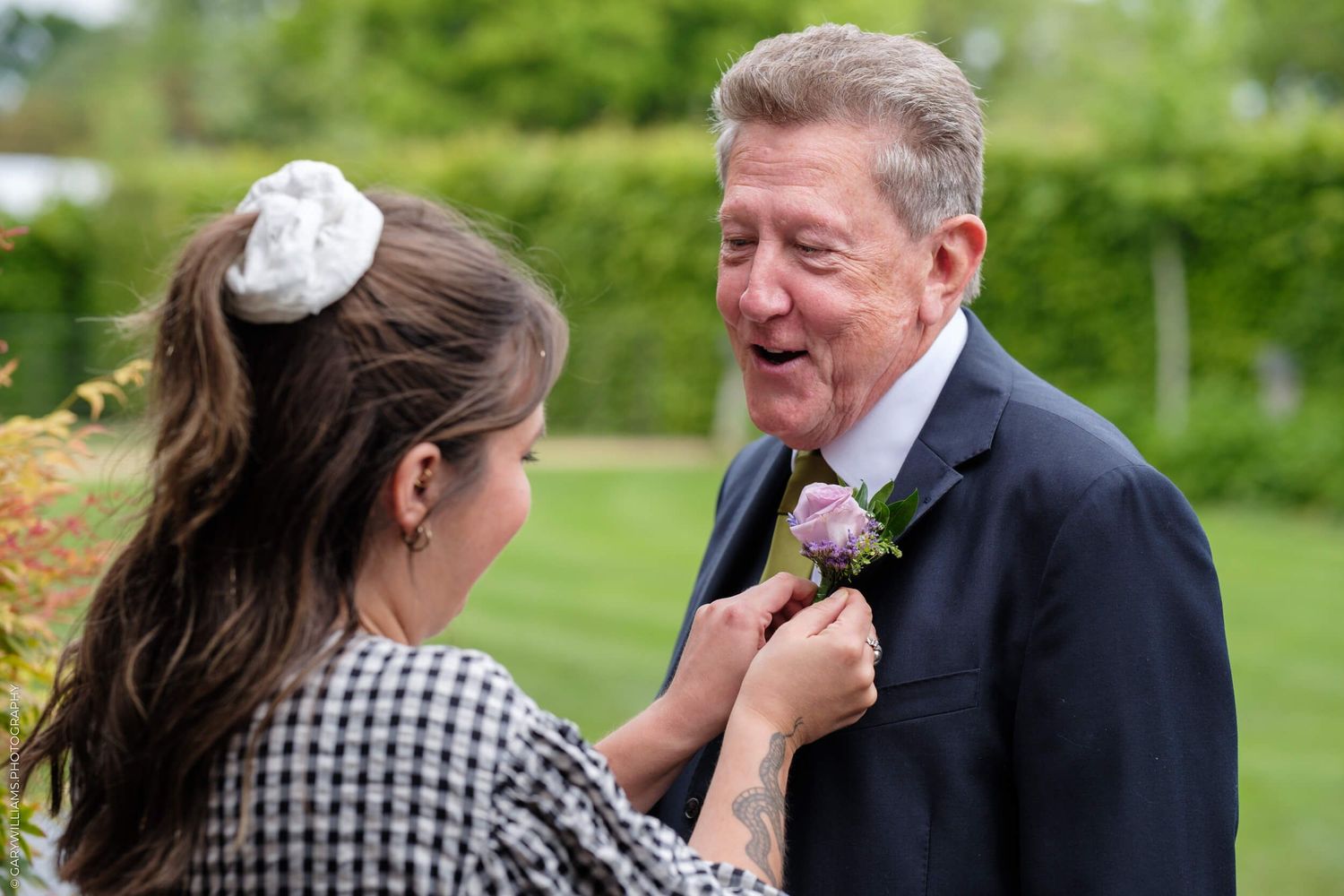 A photo collage showing tender emotional moments during an outdoor wedding ceremony set in a lush green garden.