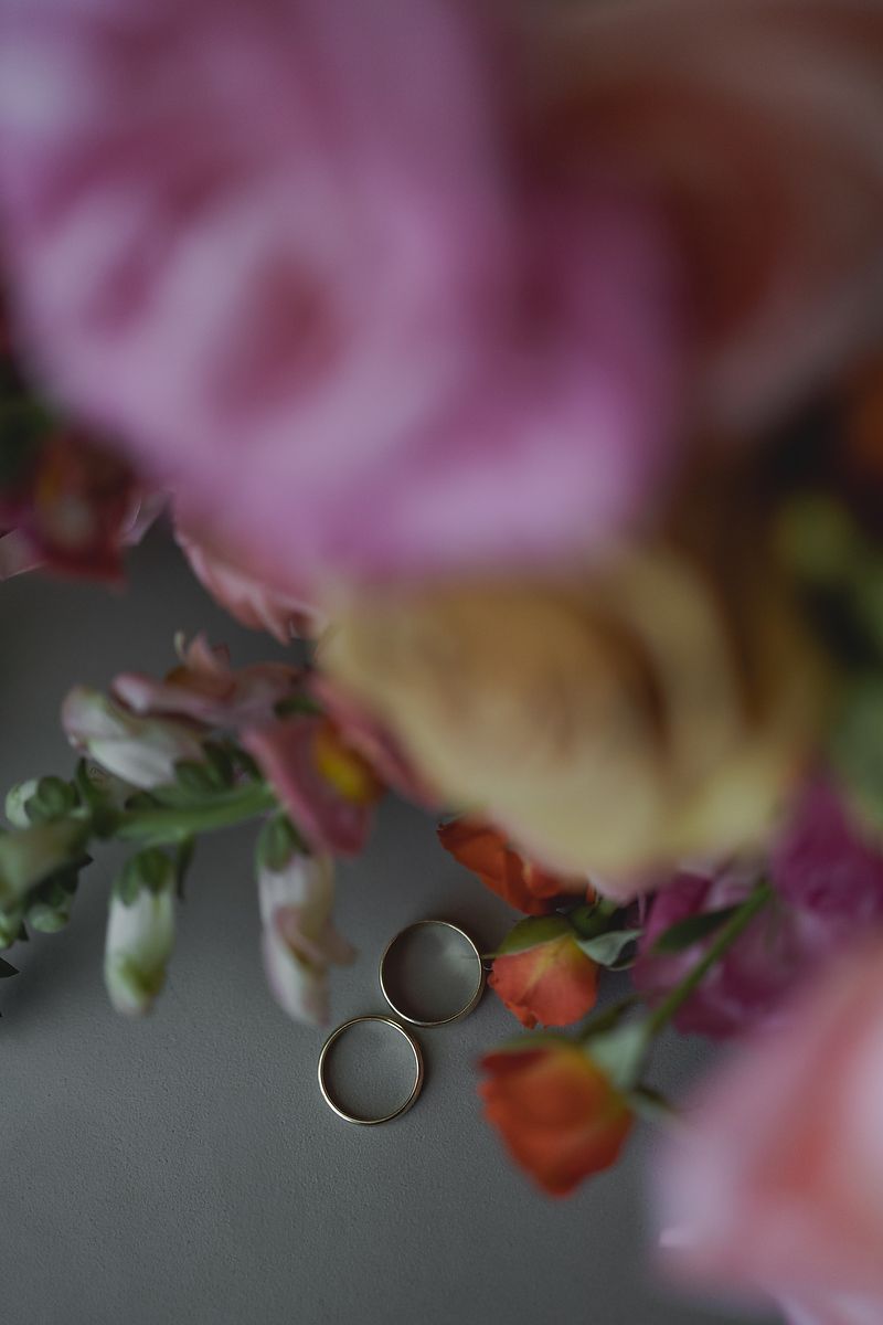 Macro view of pink floral arrangement with blurred edges creating a dreamy bokeh effect against soft background.