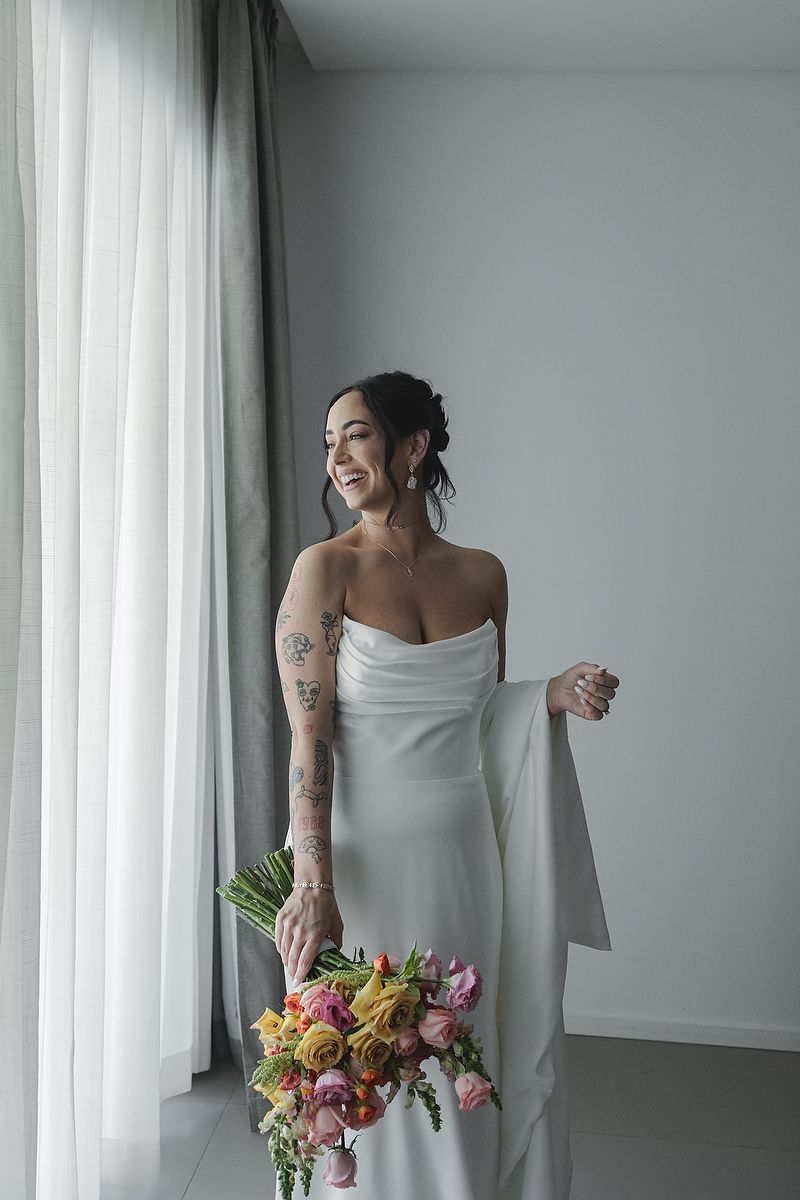 Bride portrait with bouquet and natural light Majestic Elegance Costa Mujeres Riviera Maya wedding photography.