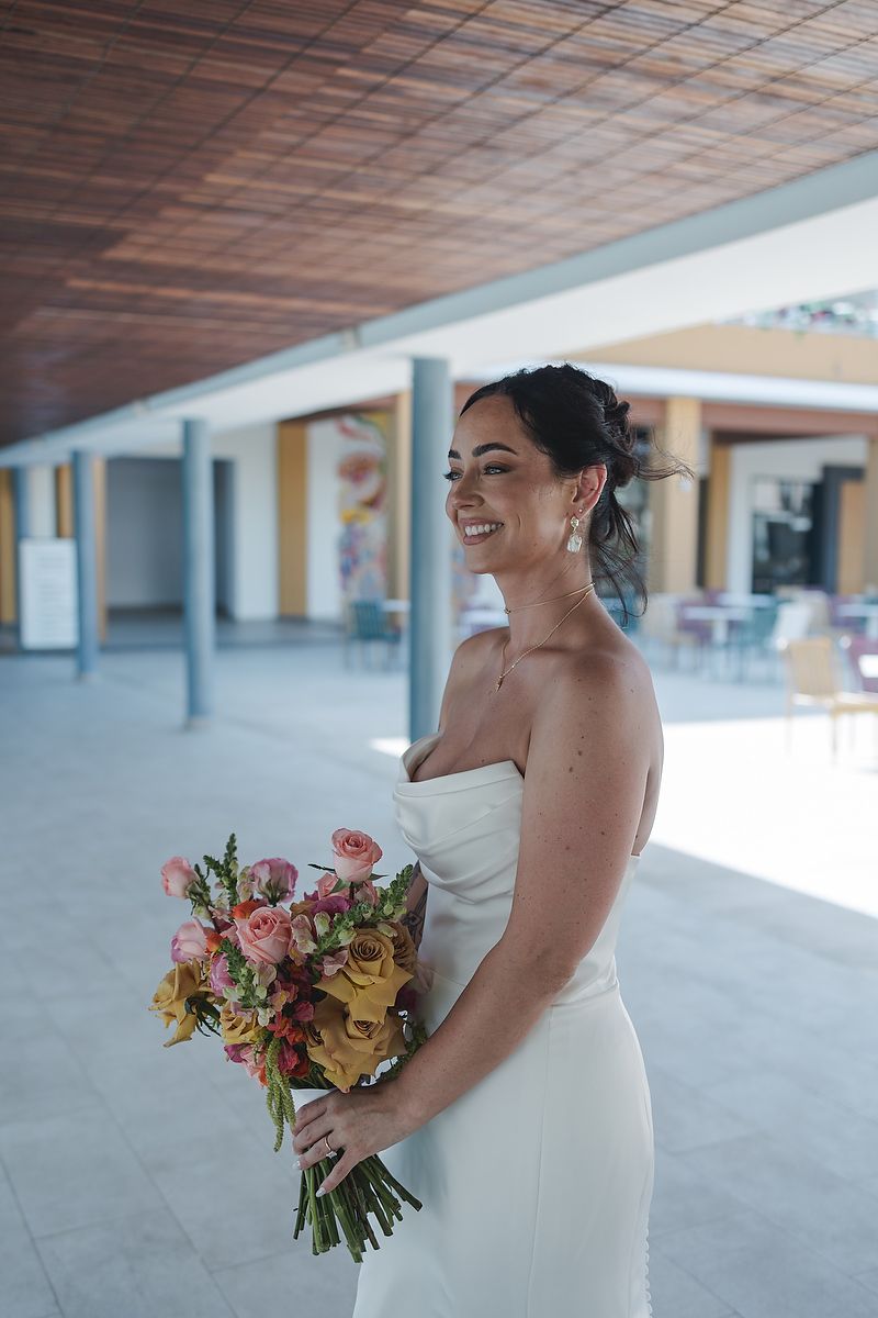 Bride walking with bouquet before ceremony Majestic Elegance Costa Mujeres Riviera Maya wedding photographer.