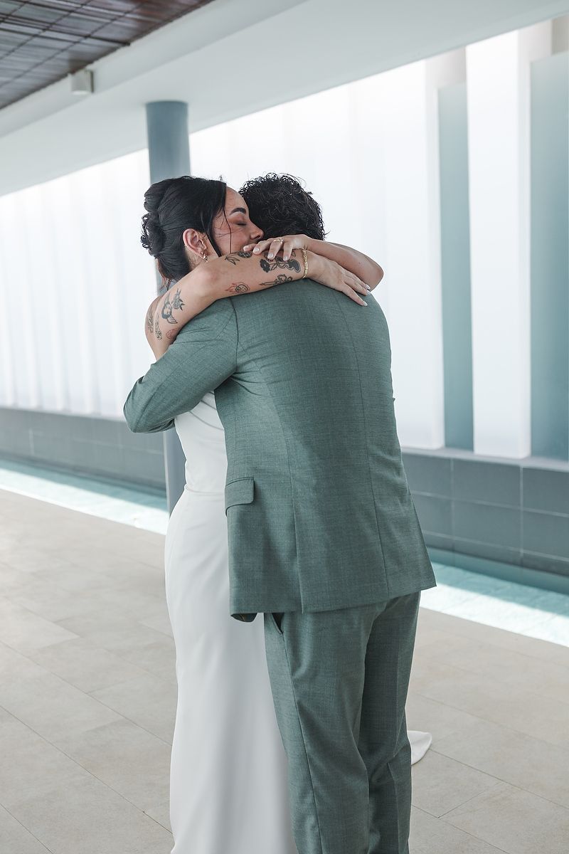 Series of romantic wedding photos showing tender embraces in a light-filled modern hallway.