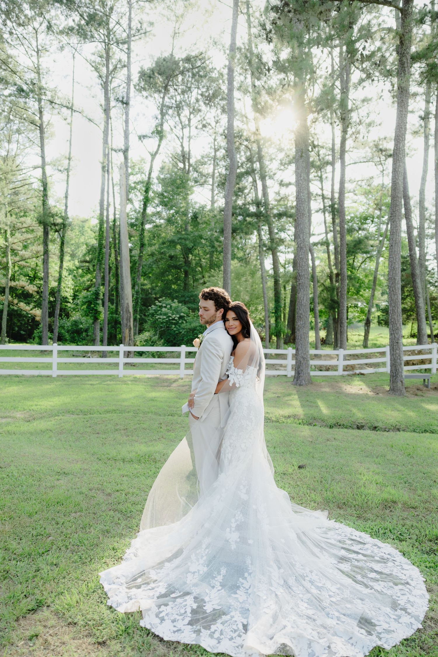 A romantic close-up of a couple sharing an intimate moment under a veil.