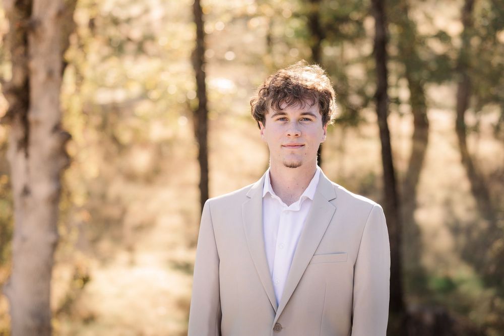A series of outdoor portraits showing someone in a beige suit and white shirt against a natural sunlit background.