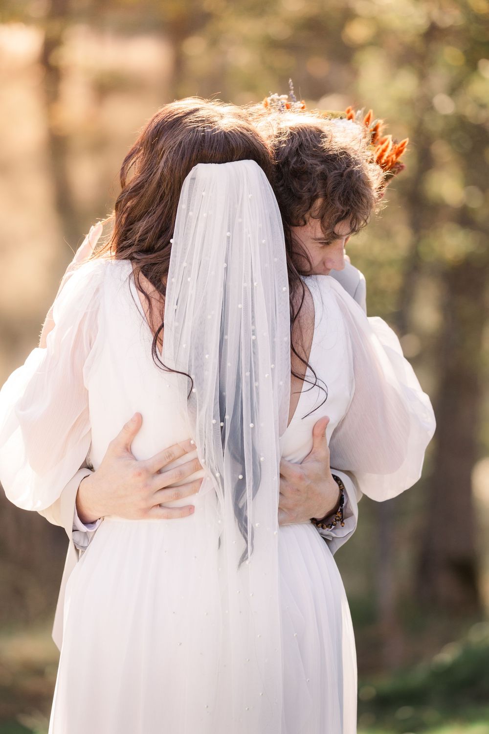 Series of intimate embraces in white wedding attire against a soft outdoor backdrop.