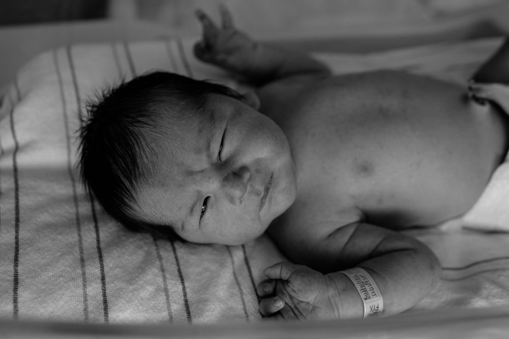A series of medical photos showing a newborn baby in a hospital setting receiving care and monitoring.