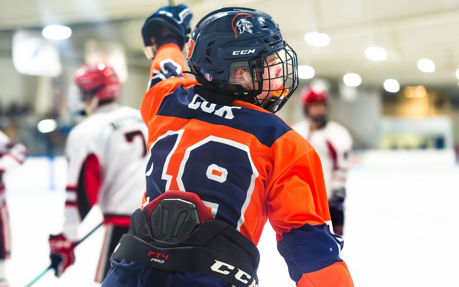 Hershey Trojans hockey player number 49 celebrating a goal during game at Klick Lewis Arena, Palmyra PA, by SportsFox Photography