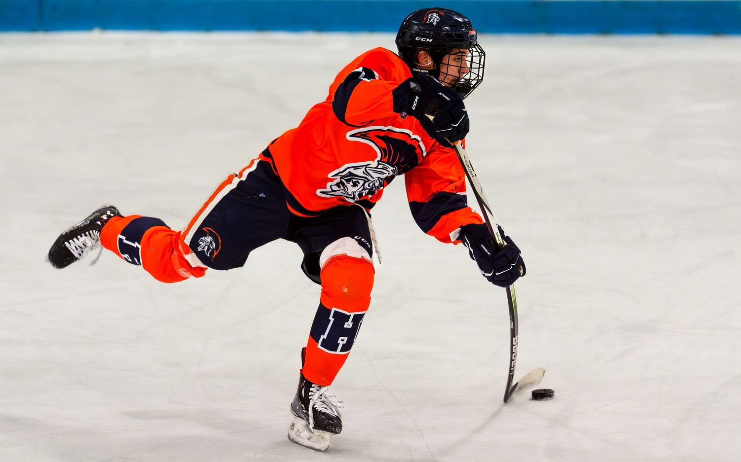 Hershey Trojans hockey player taking a slapshot on ice at Klick Lewis Arena, Palmyra PA, by SportsFox Photography