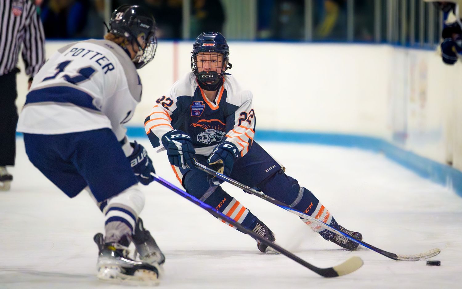 Hershey Trojans hockey players battling for puck, intense game action at Klick Lewis Arena, Palmyra PA, by SportsFox Photography