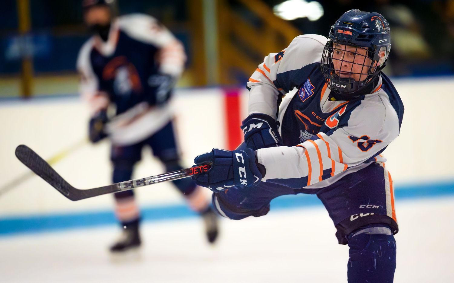 Hershey Trojans hockey player taking a slapshot during game at Klick Lewis Arena, Palmyra PA, by SportsFox Photography