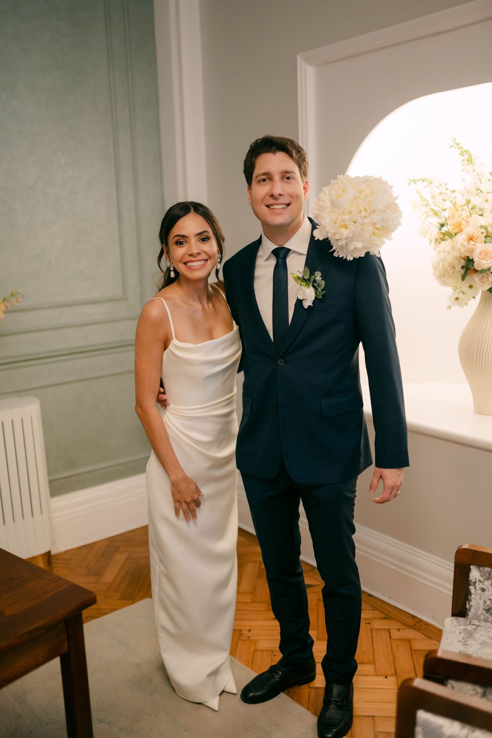 Candid wedding photo sequence showing playful moments between newlyweds in an elegant indoor setting.