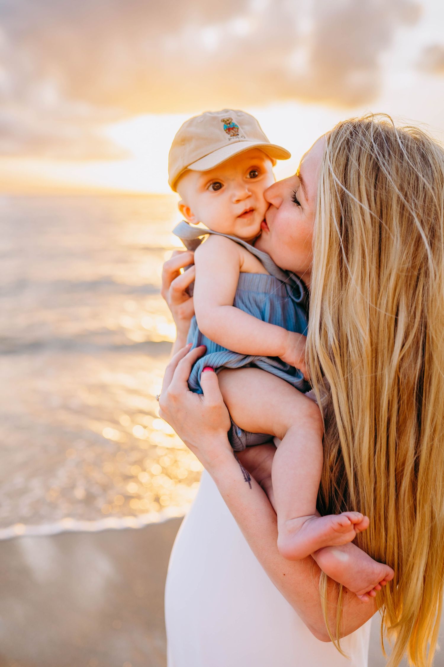 Mother and baby share tender moments during sunset beach photoshoot maui hawaii kihei wailea