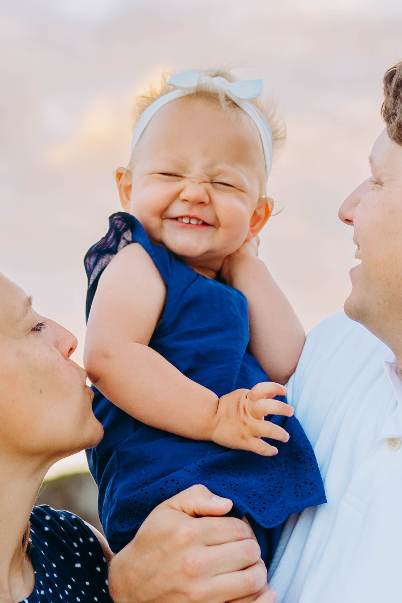 A joyful moment shared between family members on a sunny beach. best hawaii family photographer kihei wailea kaanapali makena lahaina