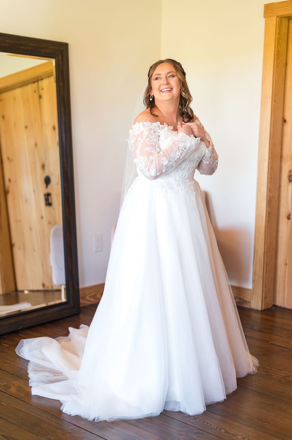 A series of photos showing a bride in a flowing white wedding gown twirling and posing on hardwood floors.