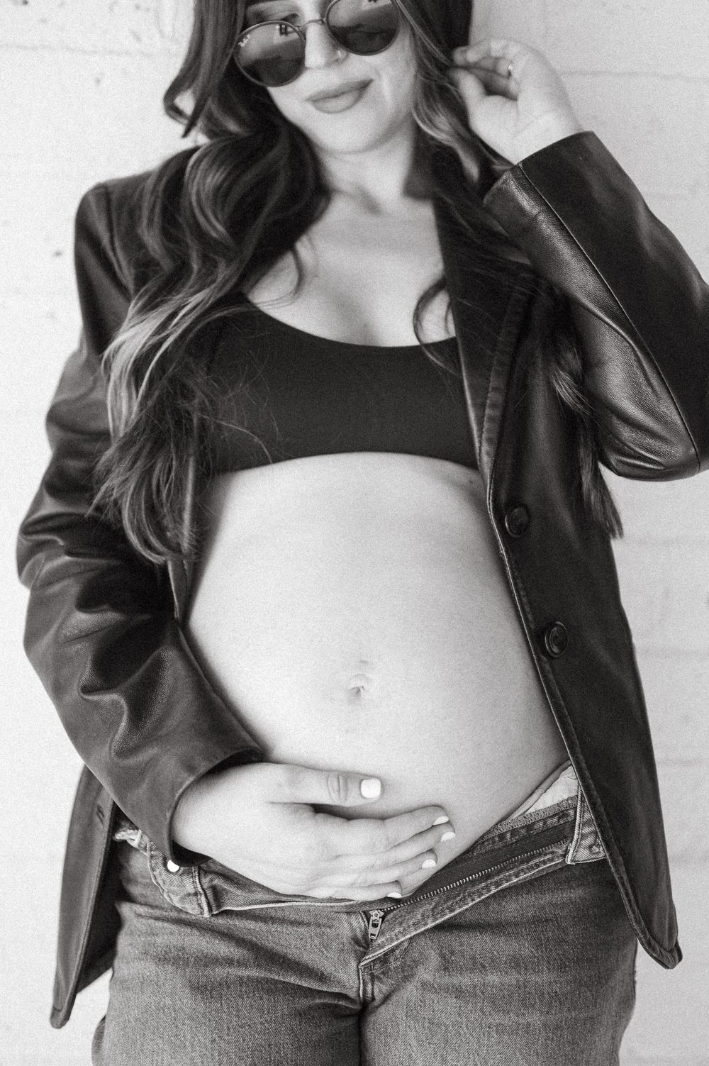 A series of black and white fashion photos showing a leather jacket and denim styling against a white background.