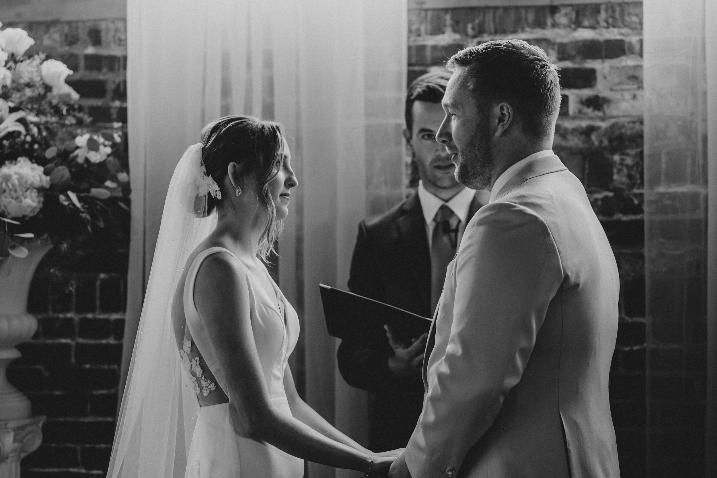 A black and white photo collage shows tender moments between a bride and groom during their wedding celebration.