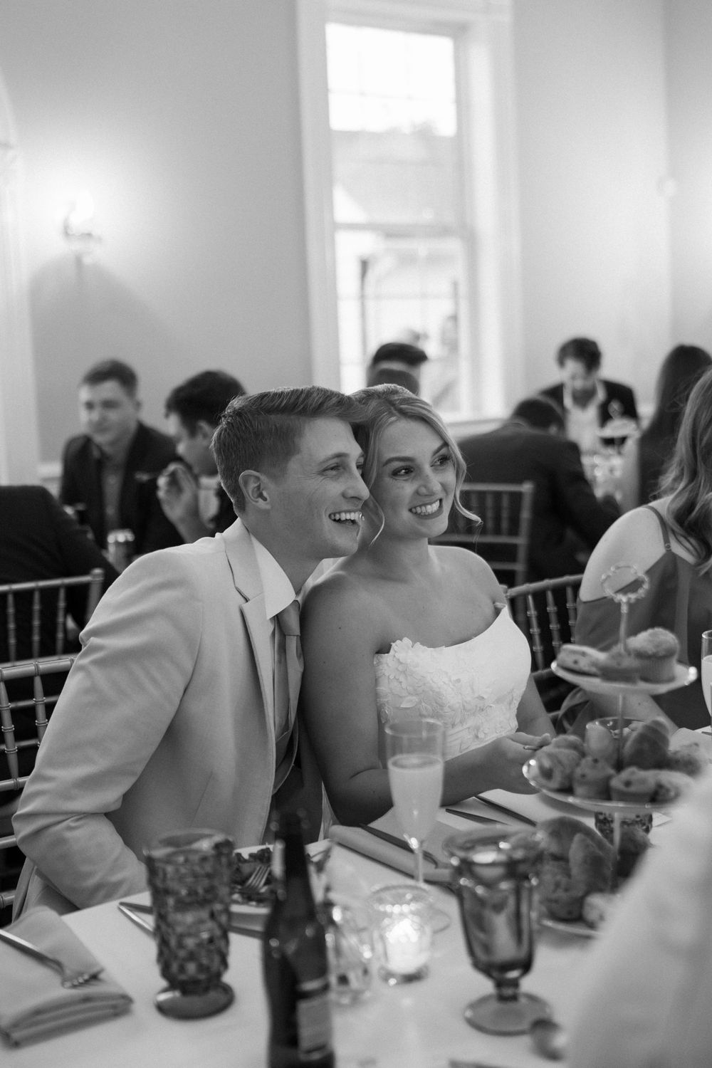 Wedding reception dining scene with guests seated at decorated tables at Lillian Gardens in Newnan, Georgia
