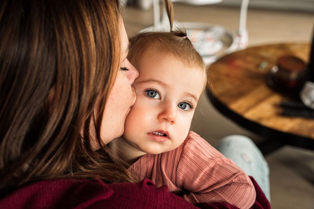 Close-up indoor portrait with gentle natural lighting and soft tones.