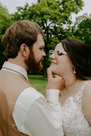 Romantic wedding couple shares intimate moments in a series of close-up photos against a green outdoor backdrop.