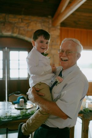 Heartwarming moment shared between two people at a wedding reception.