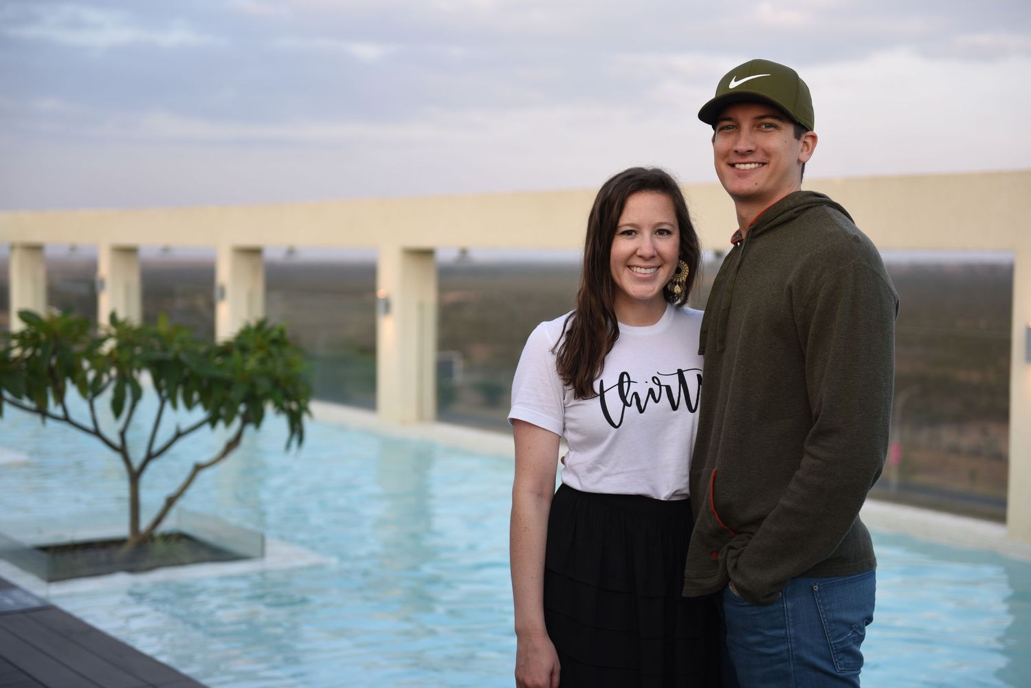 Couple by a pool.